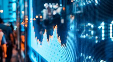 stock market numbers graph on a screen