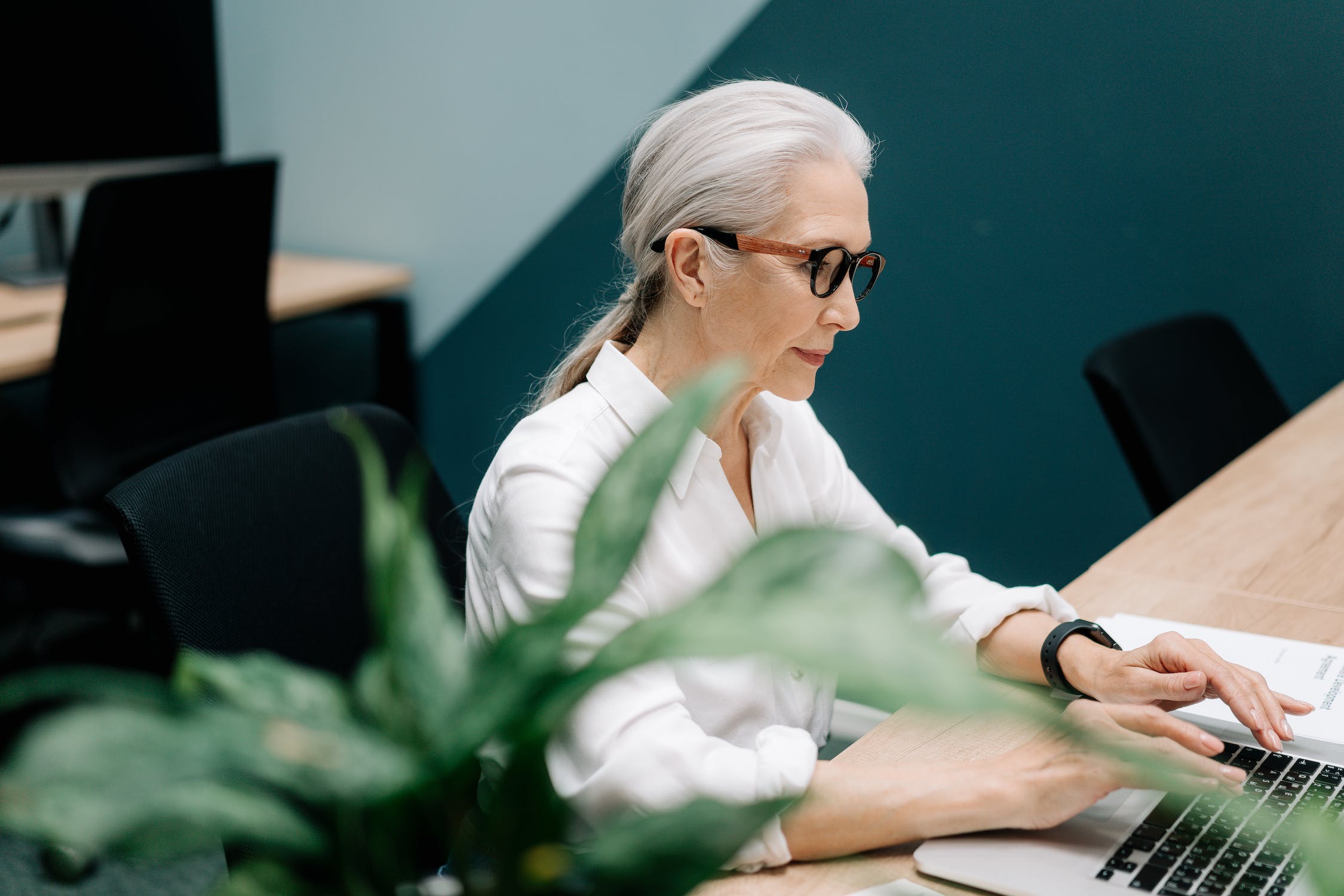 Elderly lady working on laptop