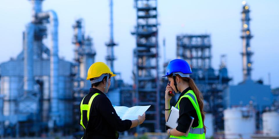 Engineers in front of city skyline