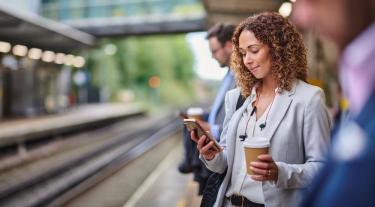 Woman using smartphone on commute