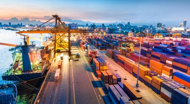 image of a port with colourful shipping containers 