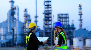 Engineers in front of city skyline