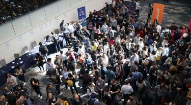 image of attendees mingling at a large event