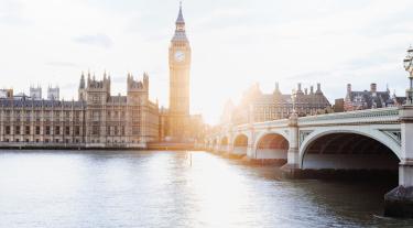 view of Big Ben and the houses of parliament from across the river thames
