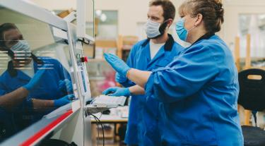 Quality control team working in production factory