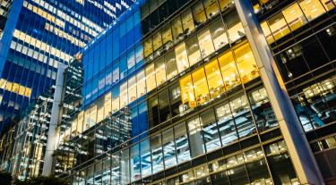 office buildings with lit up windows at night